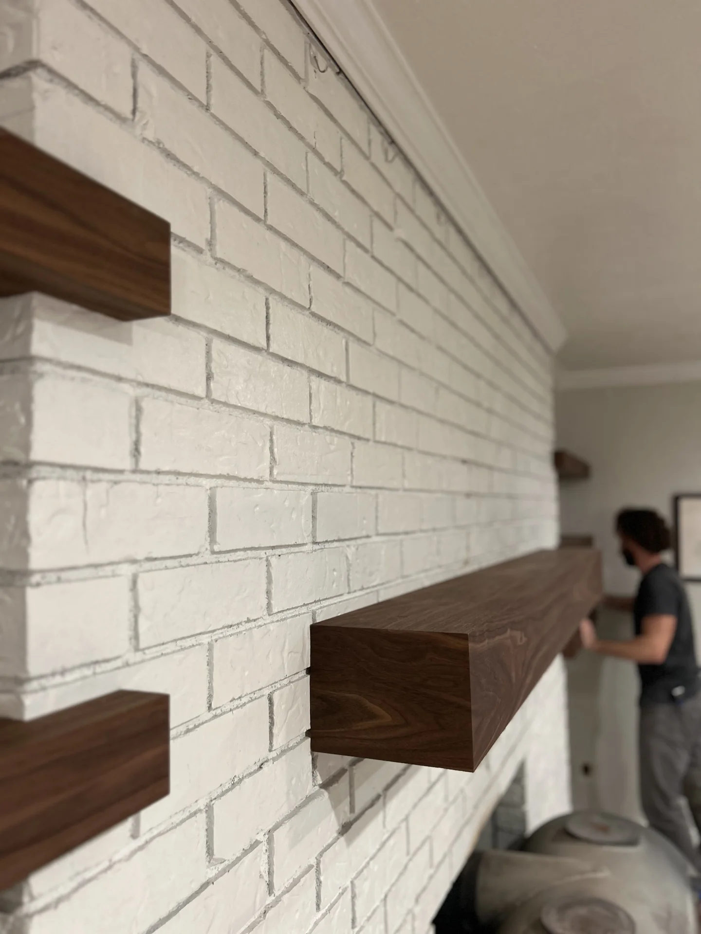 Green kitchen cabinets with modern hardware — close-up detail by Bowman Built